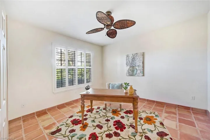 Office area featuring ceiling fan and tile patterned flooring