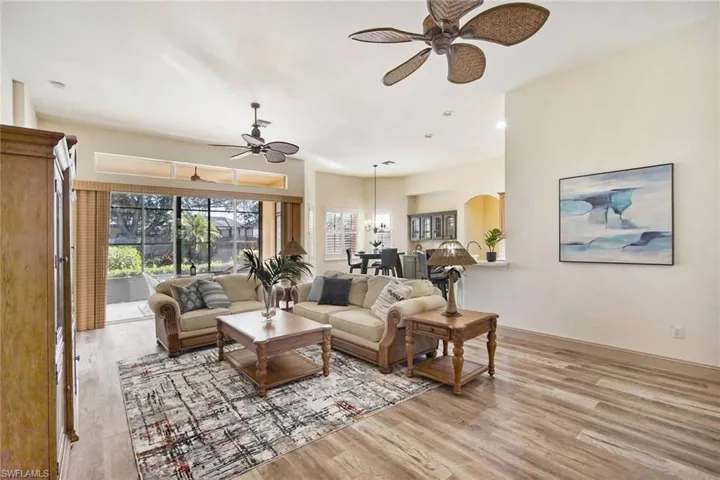Living room featuring ceiling fan and light hardwood / wood-style floors