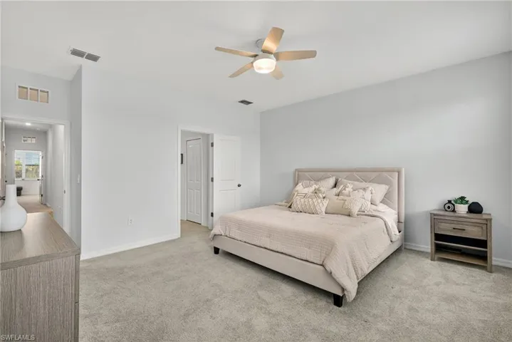 Bedroom with carpet flooring and a ceiling fan