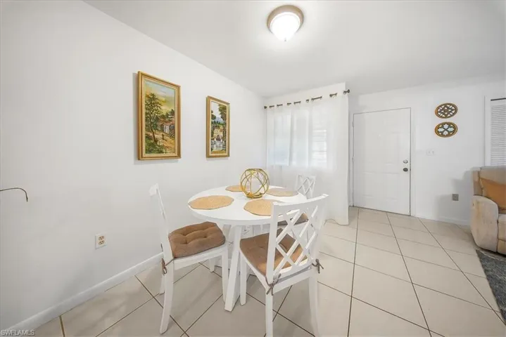 Dining room featuring light tile patterned floors