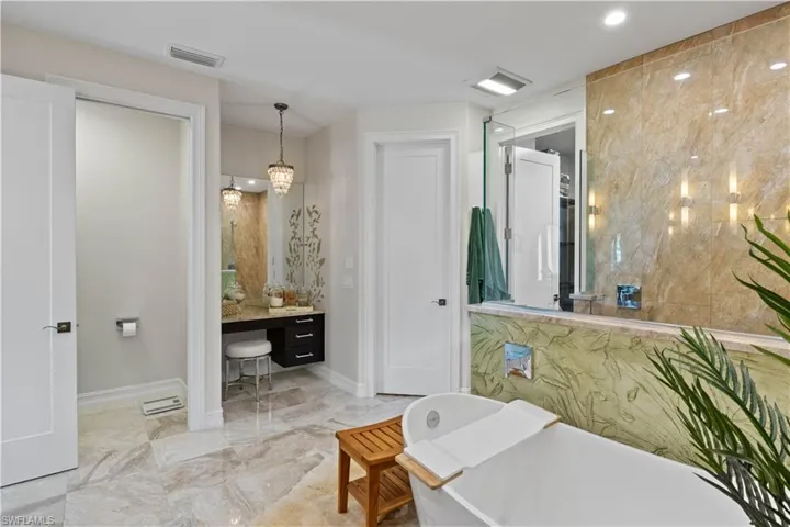 Bathroom featuring vanity and a bathing tub