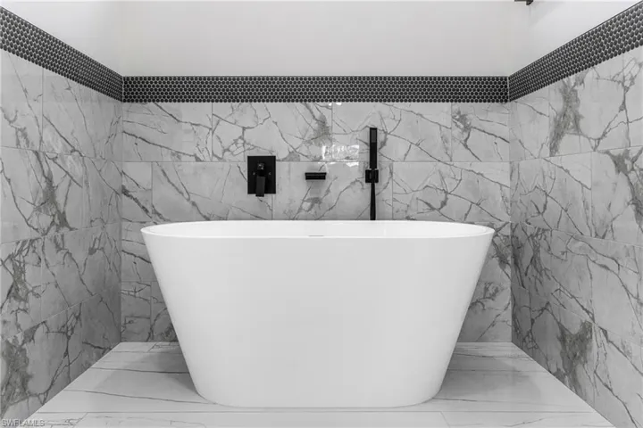 Bathroom featuring a soaking tub