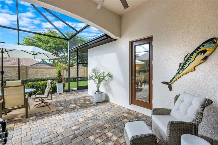 Sunroom with a patio, ceiling fan, outdoor dining area, and healthy amount of natural light