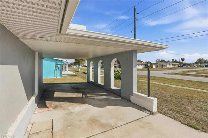 View of parking featuring a residential view