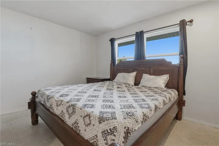 Bedroom featuring baseboards
