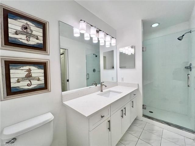 Shaker vanity and quartz countertops ... fameless shower door