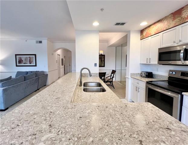Kitchen opens to both living room and dining room