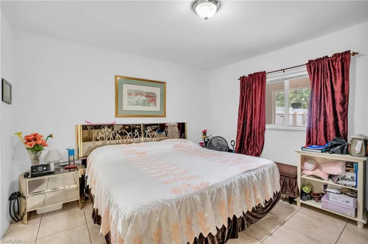 Bedroom with tile floors