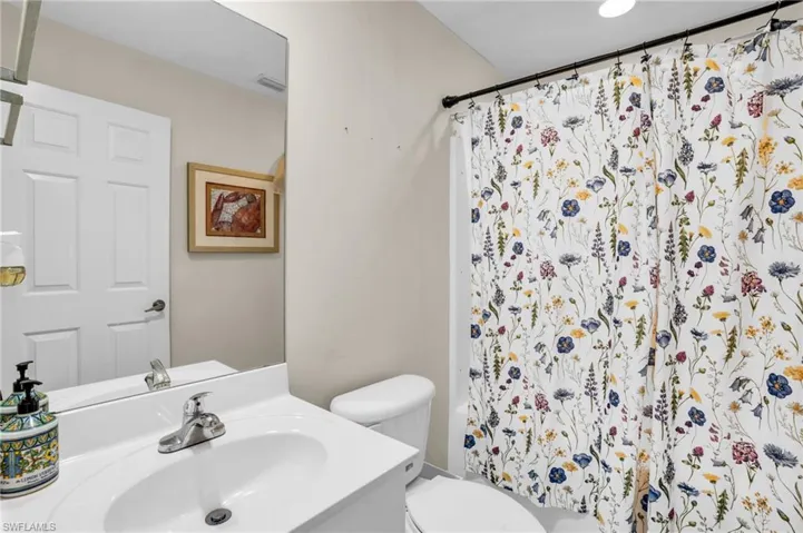 Bathroom with toilet and large vanity