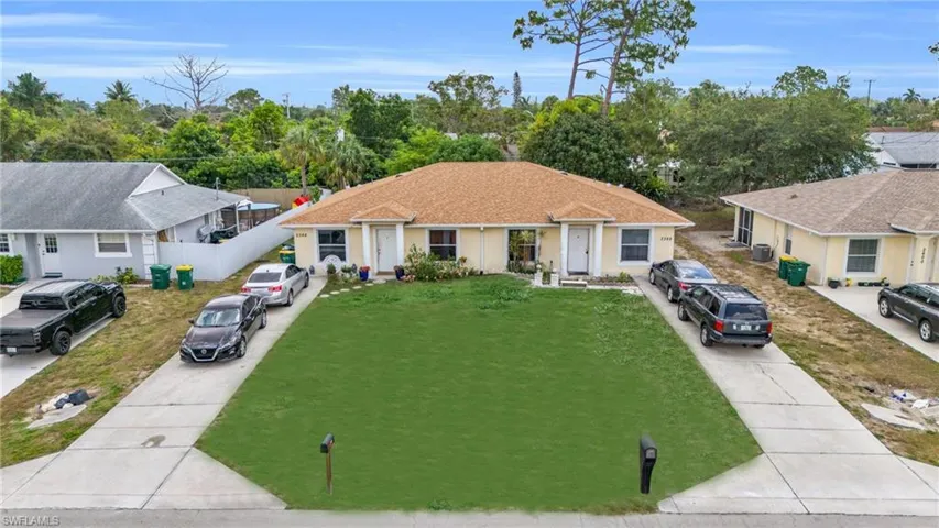 Single story home with a front yard