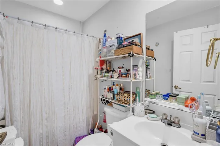 Bathroom with toilet and large vanity