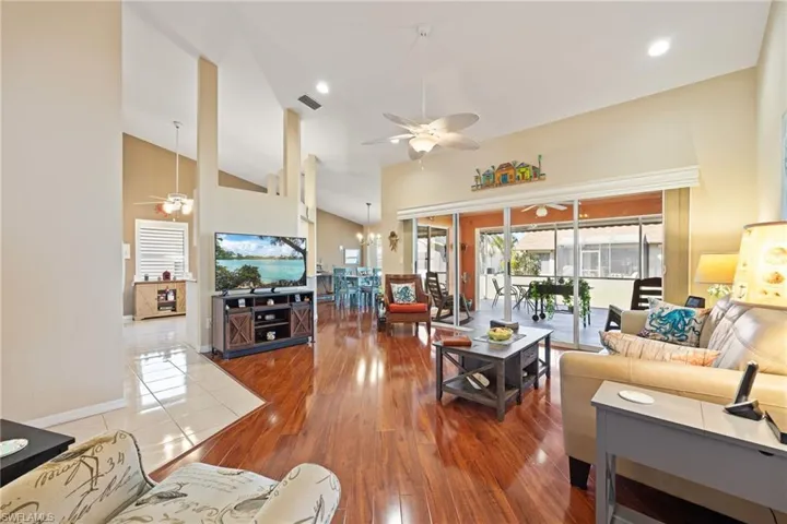 Living room with sliders to the spacious screened lanai