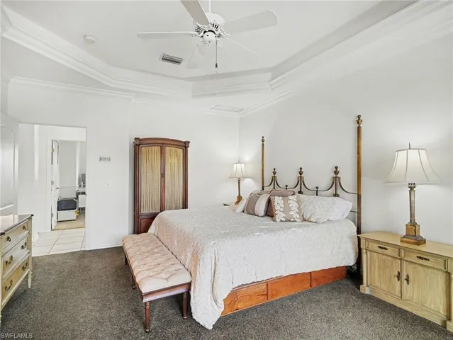 Alternate view of primary bedroom. Look at that beautiful tray ceiling.