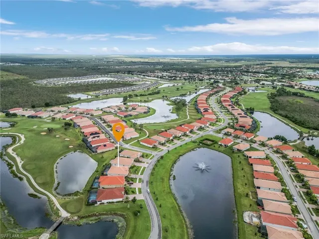 Rear view featuring the golf course and water.