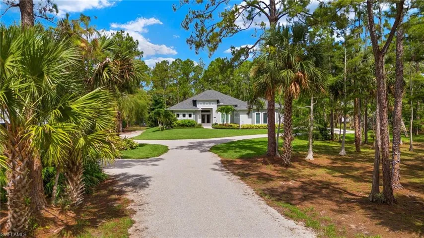 View of home's community with a yard
