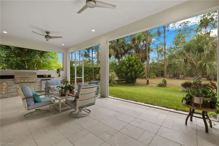 Sunroom featuring ceiling fan