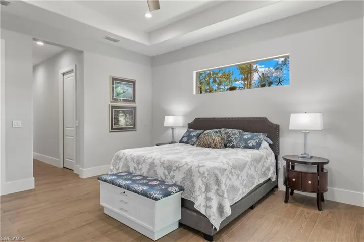 Bedroom featuring ceiling fan and light hardwood / wood-style flooring