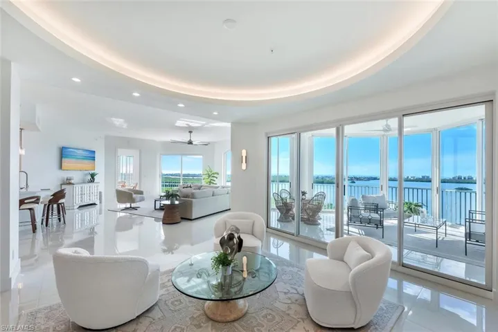 Living area with recessed lighting, water view and porcelain flooring