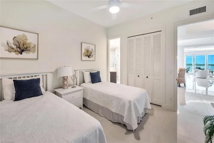 Bedroom with a closet,  ceiling fan, full bath