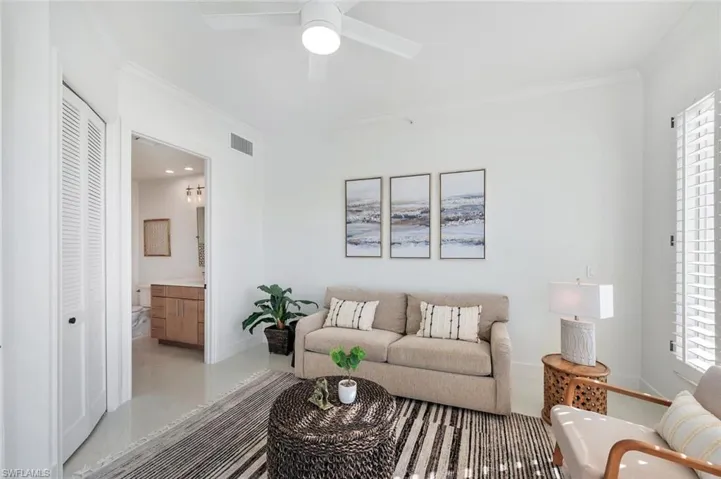 Guest room with ceiling fan, walk out to open air balcony, sofa bed and private bath