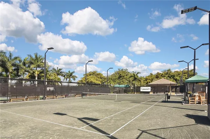 View of tennis court with community basketball court