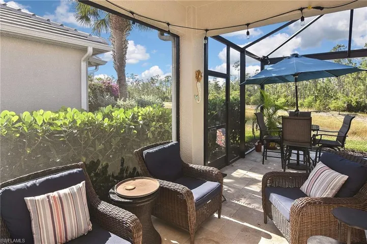 Sunroom / solarium featuring a patio area and plenty of natural light