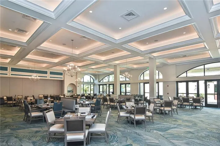 Lobby featuring coffered ceiling, beam ceiling, and a towering ceiling