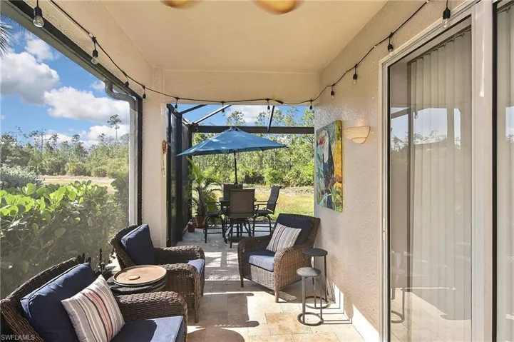 Sunroom with outdoor dining area, a patio area, and outdoor lounge area
