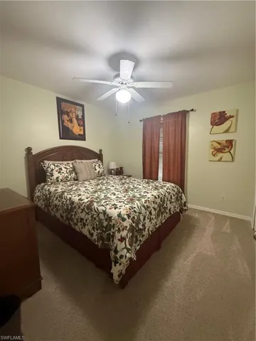 Bedroom with carpet flooring and a ceiling fan