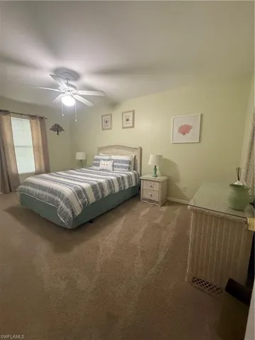 Bedroom featuring carpet and a ceiling fan