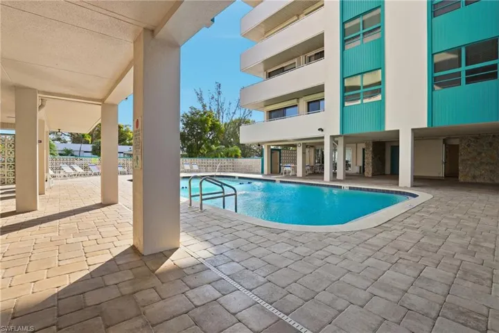 Community pool with a patio area