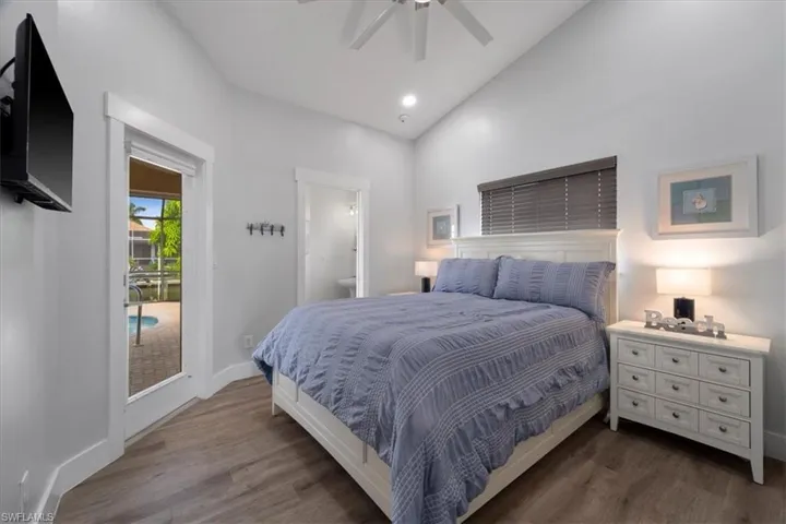 Bedroom with connected bathroom, access to outside