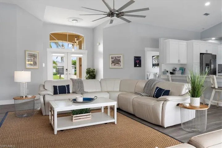 Living room with high vaulted ceiling