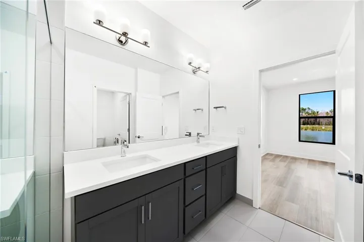 Moen Faucets in All Bathrooms & Raised Height Vanities in All Bathrooms