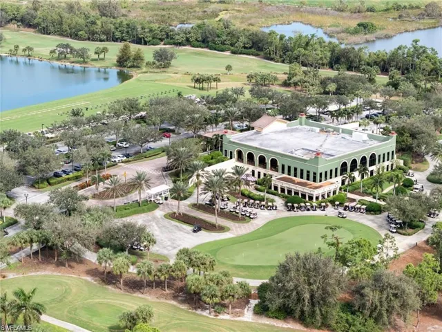 Bird's eye view with golf course view and a water view