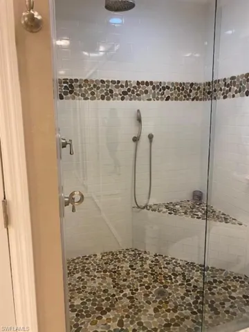 Bathroom with a shower with door