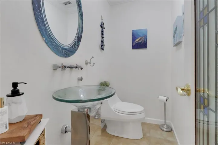 Bathroom featuring toilet and tile patterned floors