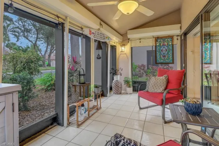 Sunroom with vaulted ceiling and ceiling fan
