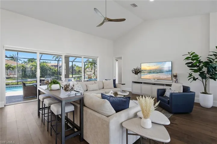 Living room opens to lanai through NEW hurricane sliders
