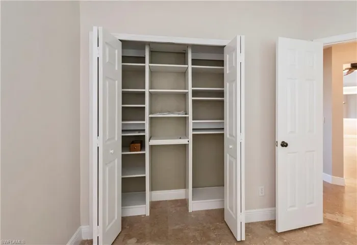 Custom Shelving in guest bedroom closets