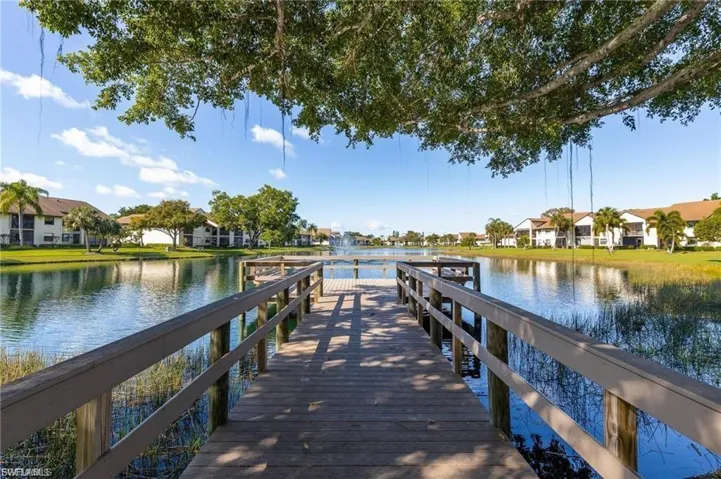 Dock area featuring a residential view and a water view