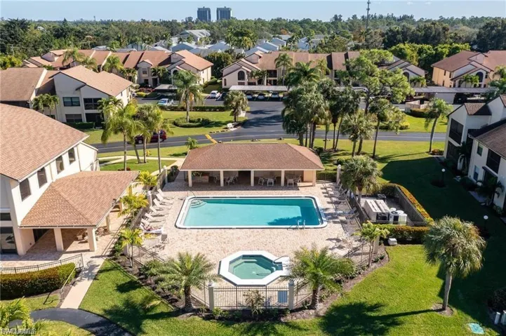 Aerial view of residential area featuring a pool