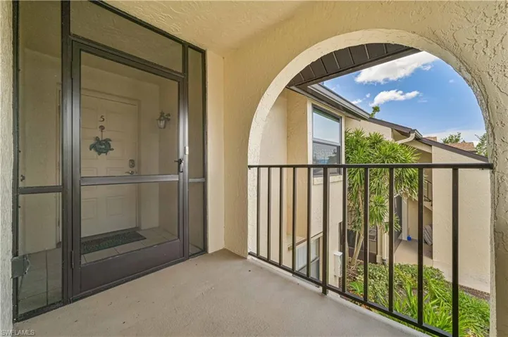 Property entrance featuring stucco siding