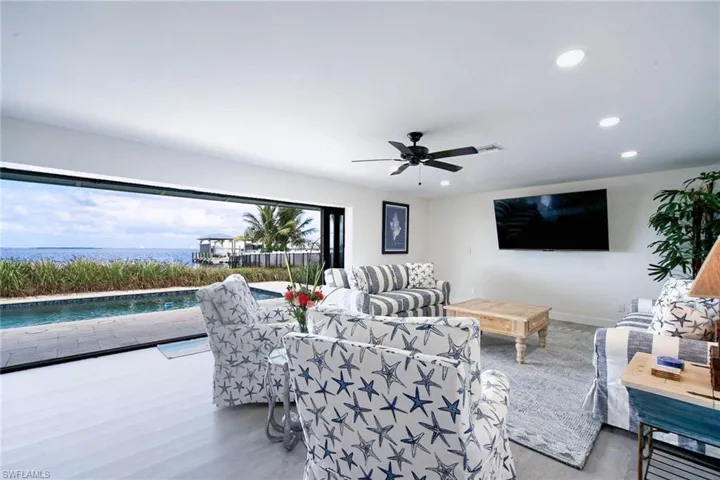 Great room features views of the gorgeous pool and water views of the Bay!