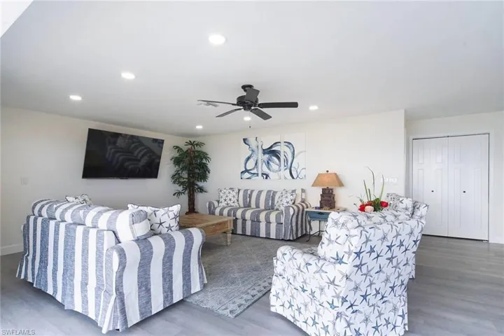 Spacious Great room features recessed lighting and LVP flooring.