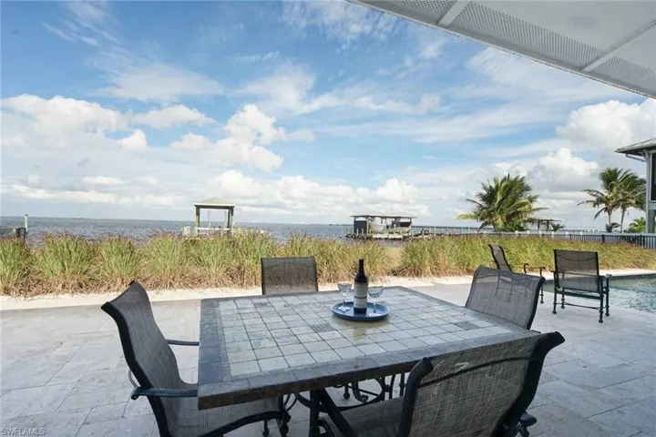 Enjoy your favorite beverages from the huge Travertine Patio and Pool deck area while watching the boats and Dolphins on the Bay!