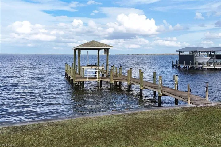 Covered dock with LED lights, fish cleaning station, water, and electricity