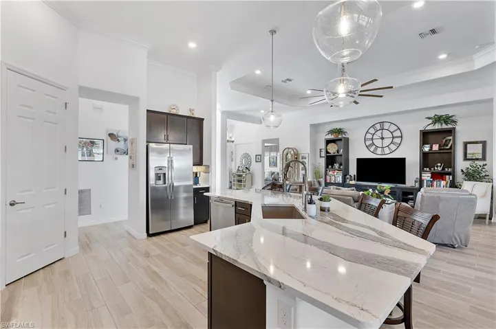 Kitchen featuring a spacious island and appliances with stainless steel finishes