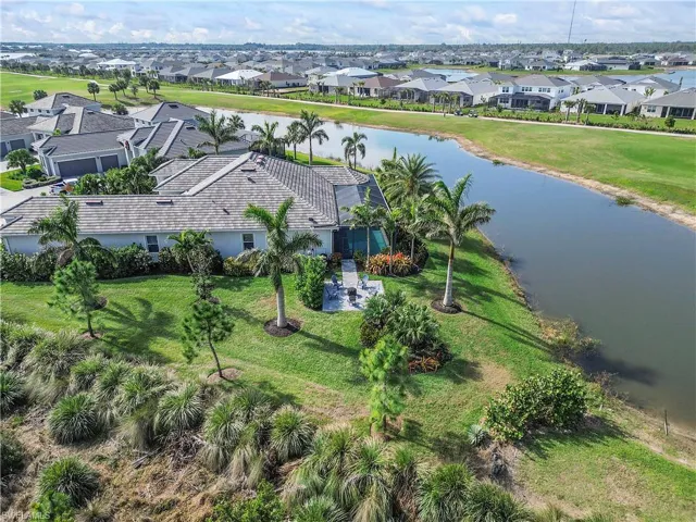 Birds eye view of property featuring a residential view and a water view