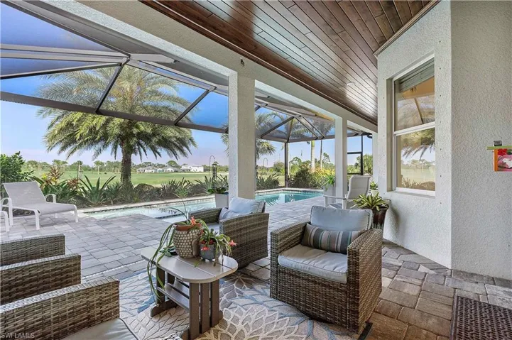 Sunroom featuring visible vents and wood ceiling